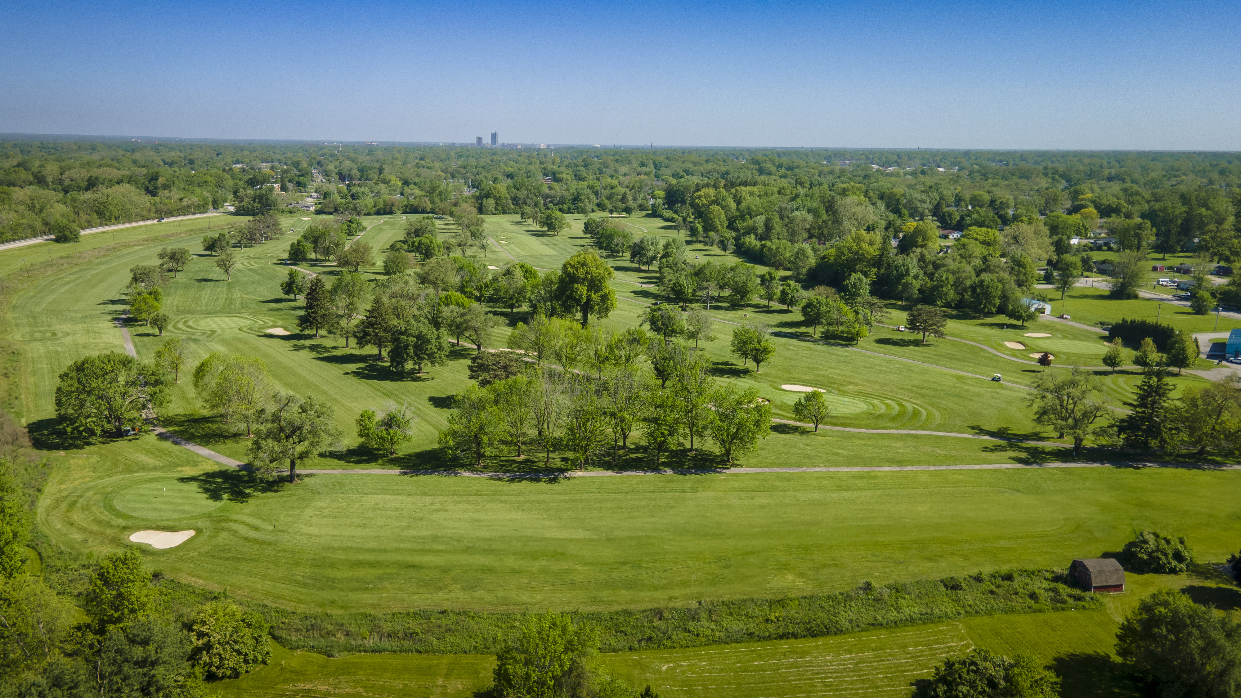 Golf course green from above with trees